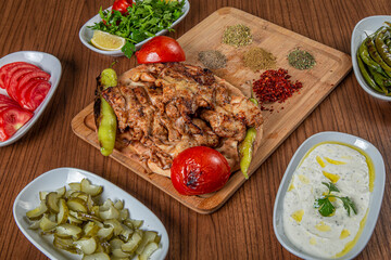 Turkish chicken butterfly on a wooden background.