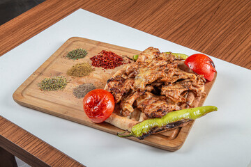 Turkish chicken butterfly on a wooden background.