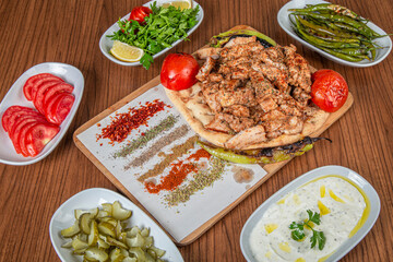 Turkish chicken meal on a wooden background.