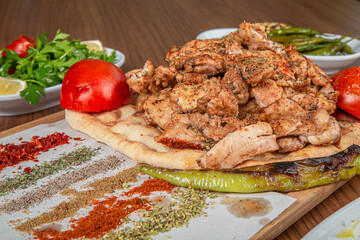 Turkish chicken meal on a wooden background.