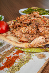 Turkish chicken meal on a wooden background.