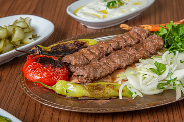 Turkish Urfa Kebab Skewer Dinner on Wooden Background