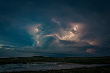 Fototapeta na wymiar Lighting Over Water on the Great Plains