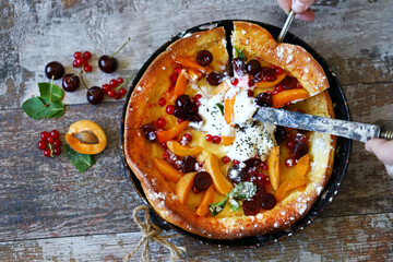 Selective focus. Macro. Dutch baby pancake with fruit. Healthy breakfast or dessert.
