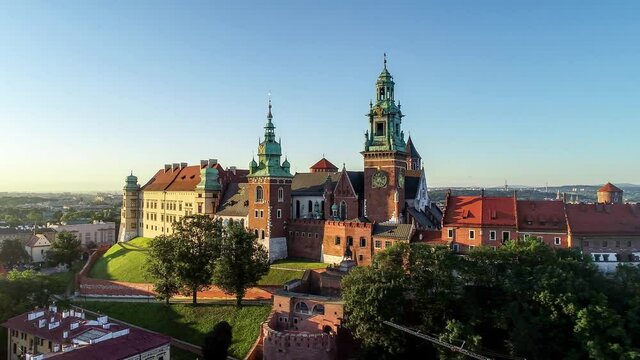 Historic royal Wawel cathedral and castle and in Cracow, Poland.  Aerial flyby 4K video in sunrise light, early morning in summer