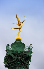 golden statue in the city paris