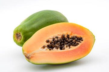 Vitamin rich exotic fruits concept with photograph of whole papaya and halved fruit isolated on...