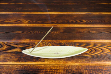 incense sticks on a wooden background isolate