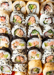 Japanese seafood sushi set isolate on black background with ice. Copy space