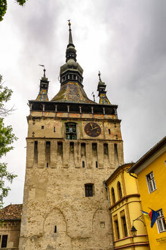 SIGISOARA, ROMANIA - JUNE 4, 2017: Medieval citadel bell tower of the historic centre of Sighisoara, Romania. UNESCO World Heritage