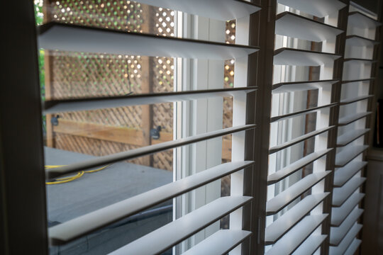 Close Up Of An Open Window With Shutters During Sunny Weather	