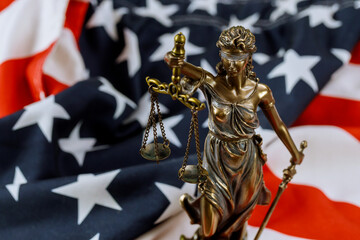 United States of America, statue of Lady Justice with USA flag