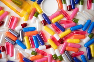 drug image, colorful pills on white background