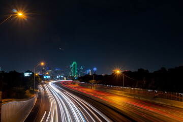 Fototapeta na wymiar Multiple Lanes Highway Leading into Downtown Dallas Skyline