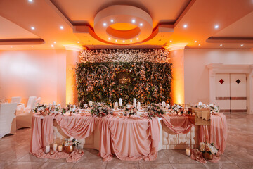 Romantically decorated table for a special event. Beautiful floral decoration for the celebration
