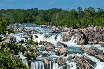 Jagged rocks, breathtaking views,  and the dangerous white waters of the Potomac River at the Great Falls Park in McLean, Fairfax County, Virginia. - obrazy, fototapety, plakaty