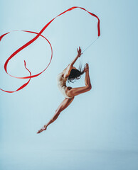Fototapeta na wymiar Woman gymnast jumping