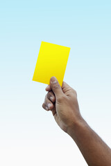 Soccer referee giving yellow card