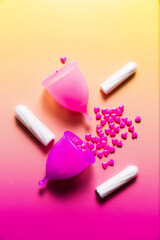 Feminine hygiene products on bright pink background