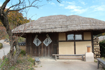 Front view of a traditional Korean cottage at Gyeongju Yangdong Folk Village in sunny day, South Korea
