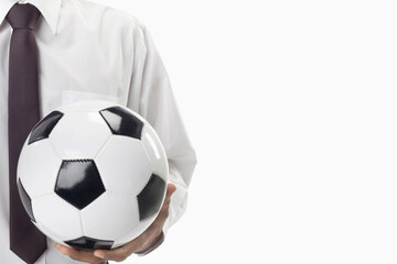 Soccer manager holding a ball