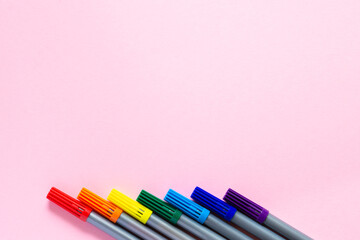 Rainbow from multi-colored felt-tip pens. Layout and flat layout with space for text. Markers are located in a row from the bottom.