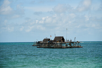 Boats and wooden fisherman house at the sea