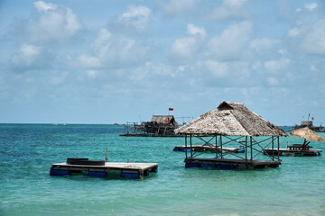 Boats and wooden fisherman house at the sea