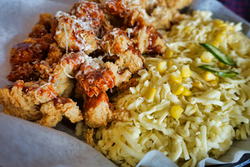 Close up of Korean style fried chicken with cheese