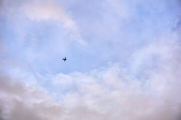 Fototapeta na wymiar Silhouette of airplane flying in the sky