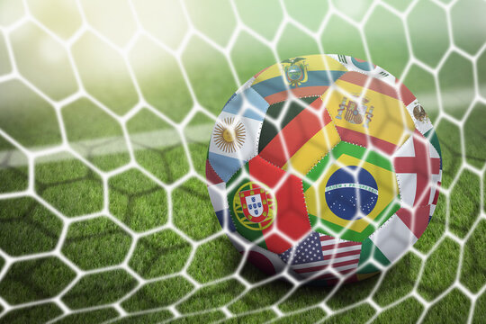 World flags soccer ball in goal net