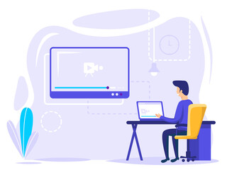 A man freelance worker who is busy in front of a laptop with a big screen. online education, distance workers. remote workers.