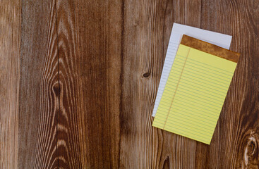 Top view of a open notebook with wood background office notepad flat lay