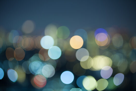 Urban city night light bokeh , defocused blur use for background, wallpaper and decoration.