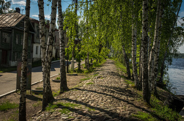 Old brick road in small town on volga river
