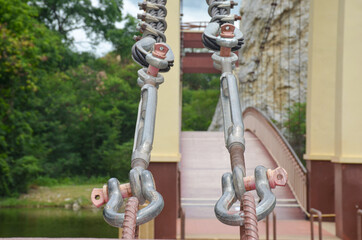 2 sling buckles are holding the bridge.