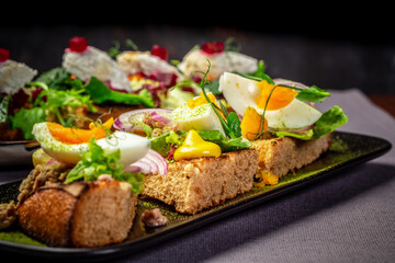 Assorted bruschetta with various toppings. Appetizing bruschetta or crudo crostini. Variety of small sandwiches. Mix bruschetta