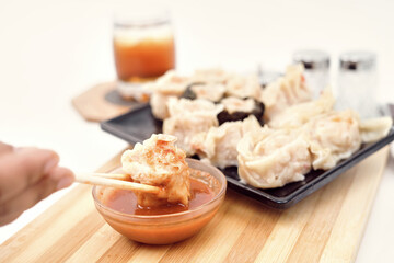 Steamed dumplings Dim Sum and ice tea on white background 