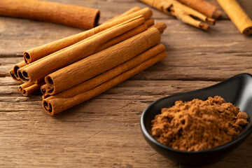 Close up Cinnamon sticks on wood plate