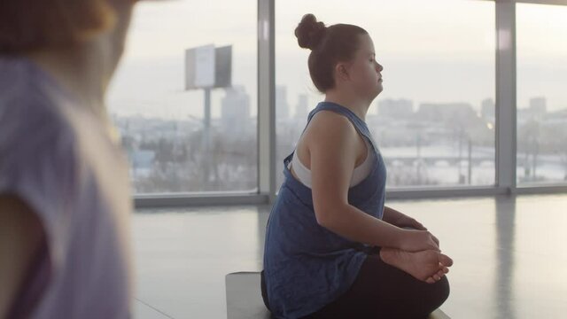 Woman with down syndrome doing yoga