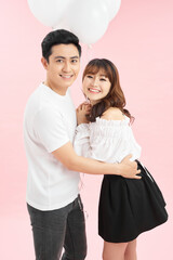 Happy emotions of the couple with the balloons