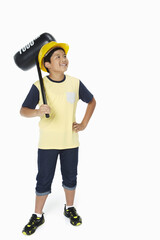 Boy holding up a toy hammer