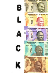 Black money concept,black alphabet on money background,Indian Currency, Rupee, Indian Rupee,Indian Money, Business, finance, investment, saving and corruption concept - Image