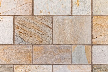 Granite brown stone block walls pattern and seamless background