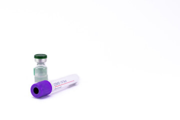 An empty blood sample tube for Coronavirus test with a vial containing transparent injectable liquid.