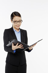 Businesswoman reading notes from a folder