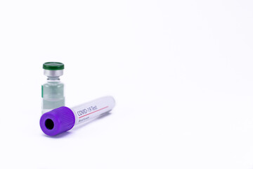 High angle close up of a COVID 19 blood sample tube with vial shot on white background and copy space.