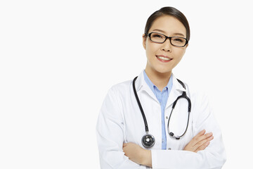Fototapeta premium Medical personnel with arms crossed, smiling