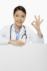 Cheerful medical personnel showing hand gesture