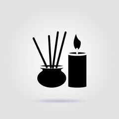 Yoga aroma candles black icon on gray background with soft shadow